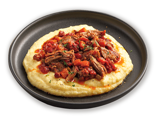 Pulled shoulder of lamb "ragù" style on a bed of polenta